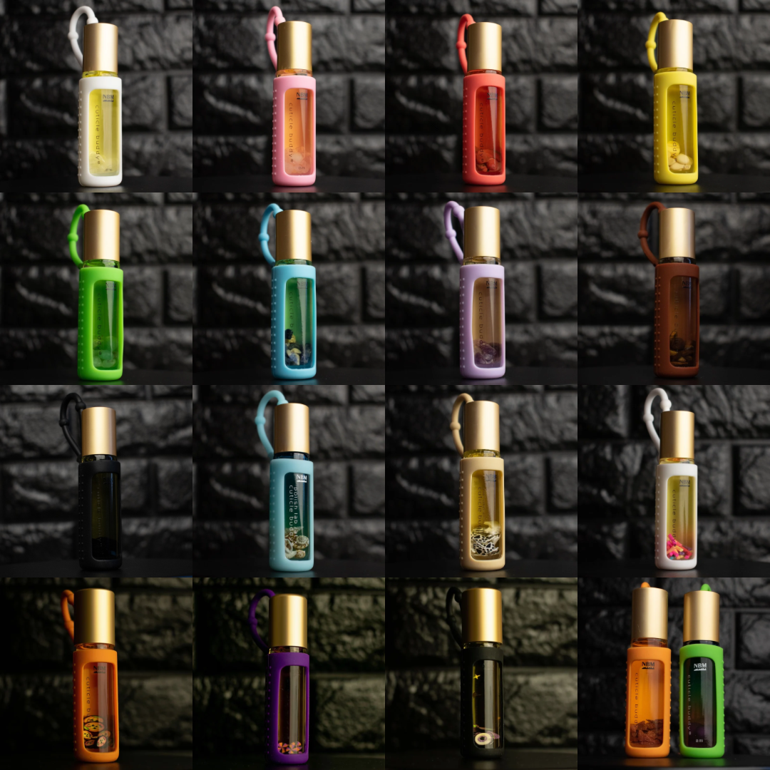 a collage of differently colored cuticle oil bottles on a black brick background