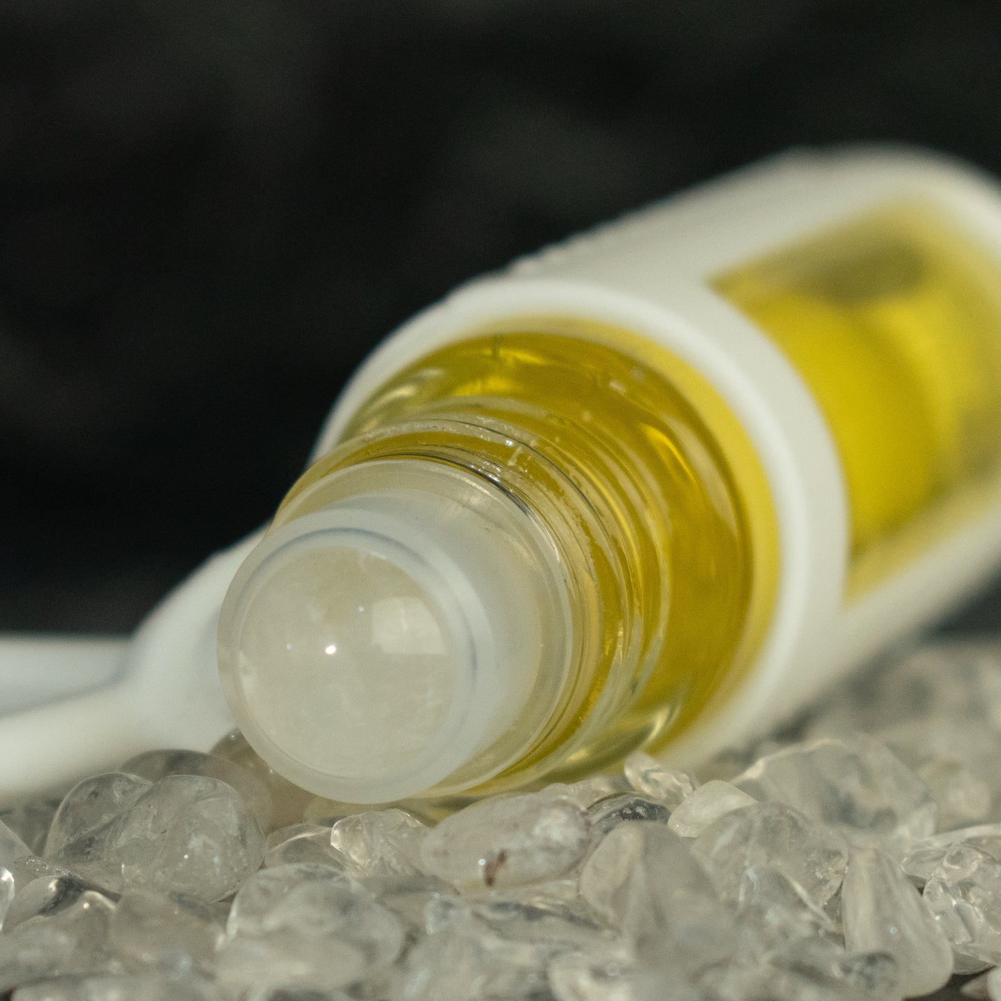 quartz rollerball in a bed of quartz stones