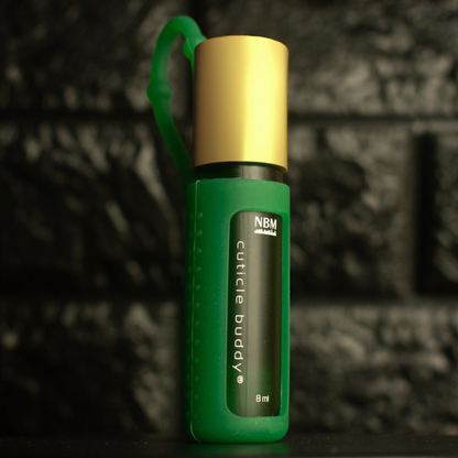green frosted bottle labeled cuticle buddy 8ml  in a green  silicone holder with a gold aluminum cap