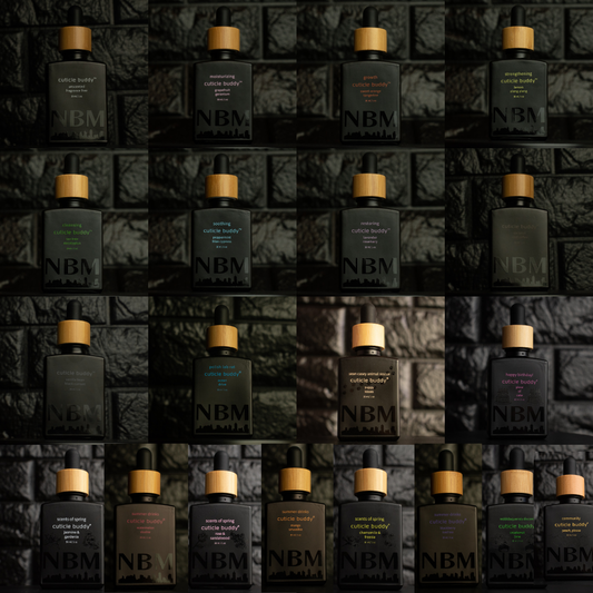 Multiple bottles of NBM dropper bottle cuticle oil cuticle buddy refills arranged in a grid on a textured dark background