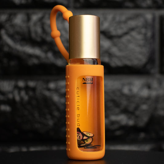 Orange bottle with gold cap on a dark background