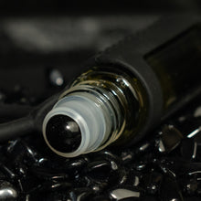 Charger l&#39;image dans la galerie, obsidian rollerball in a bed of obsidian stones

